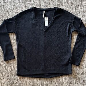 Anthropologie Black V-Neck stretch top. NWT SZ XS. Fits up to a Med.